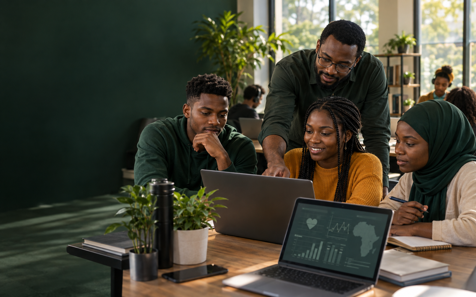 Young adults collaborating with a mentor in a healthcare technology learning lab